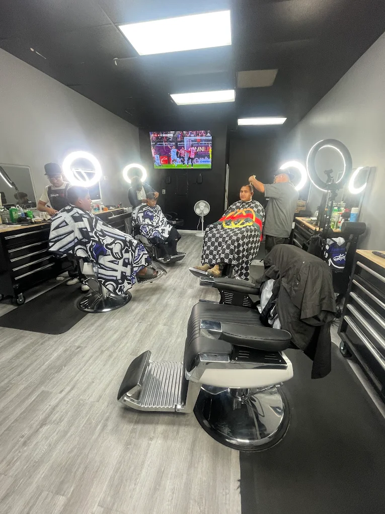 The Locals Barbershop barbers serving customers